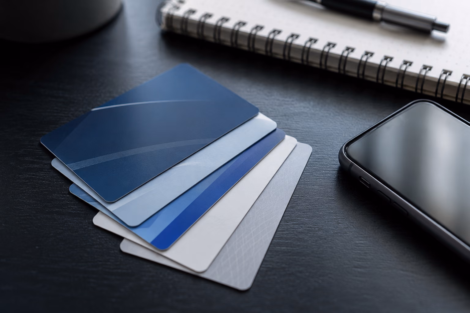 Insurance cards fanned on a desk